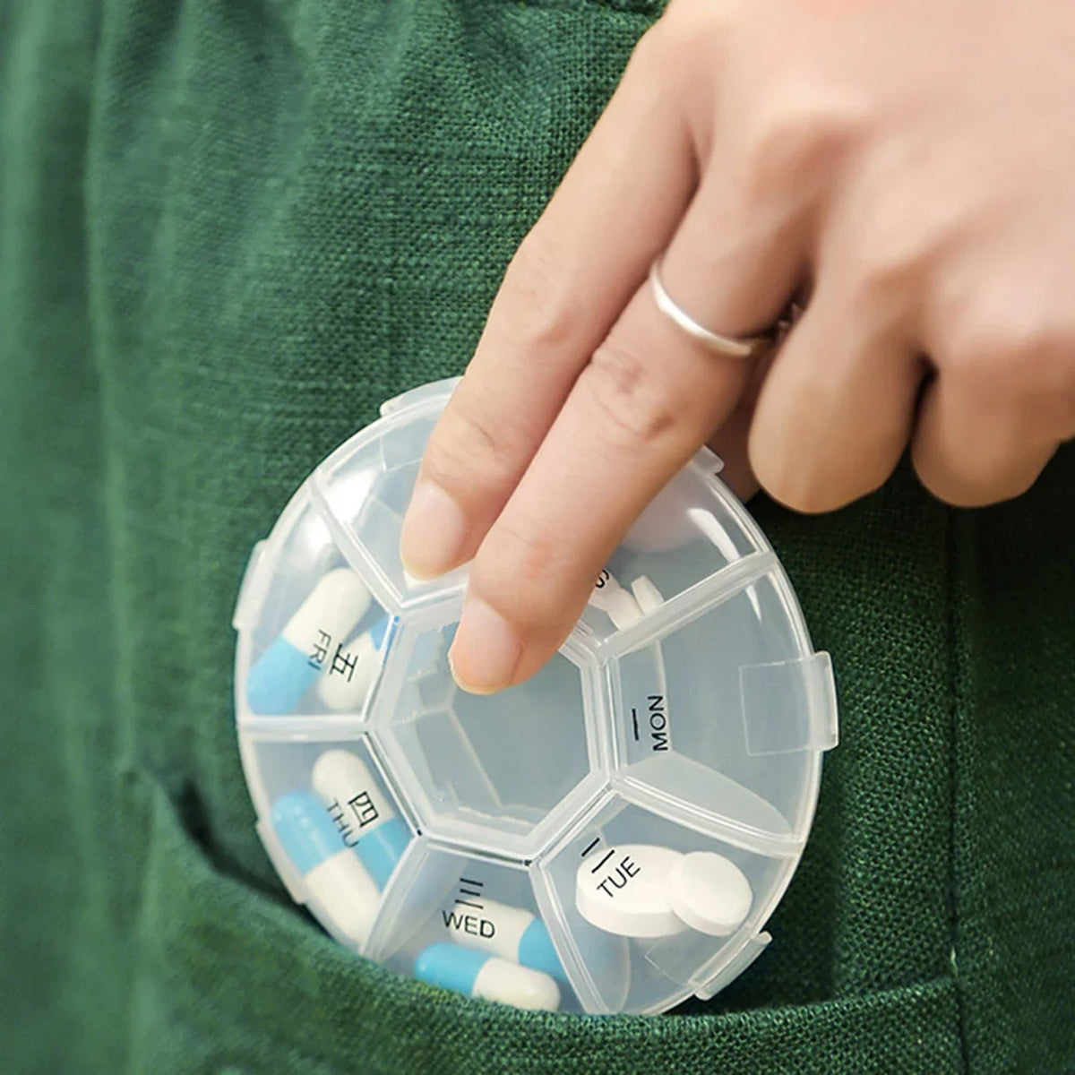 7-sided portable pill box with clear lids showing organized daily compartments Main image