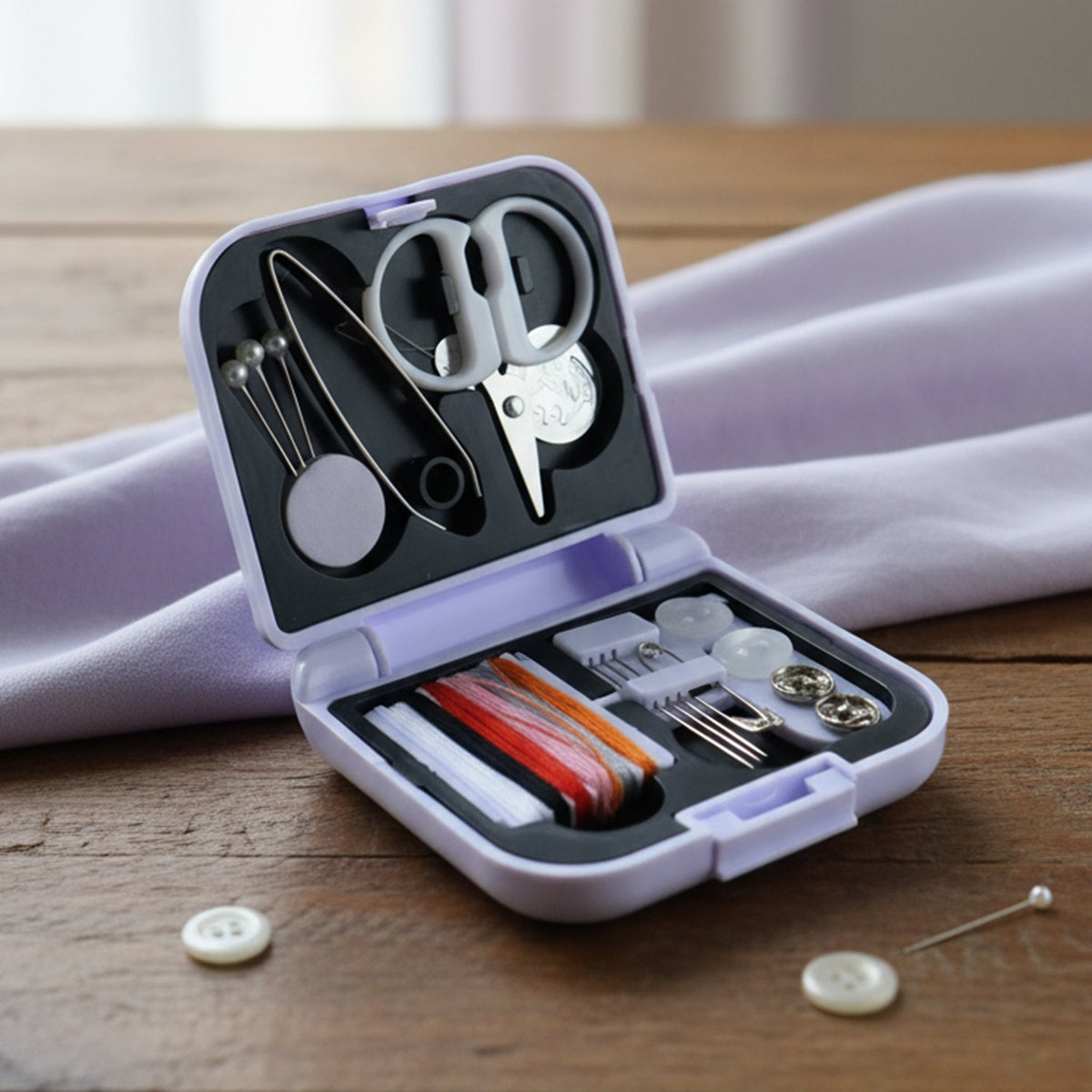 Compact portable sewing kit with organized threads and needles in case Main image