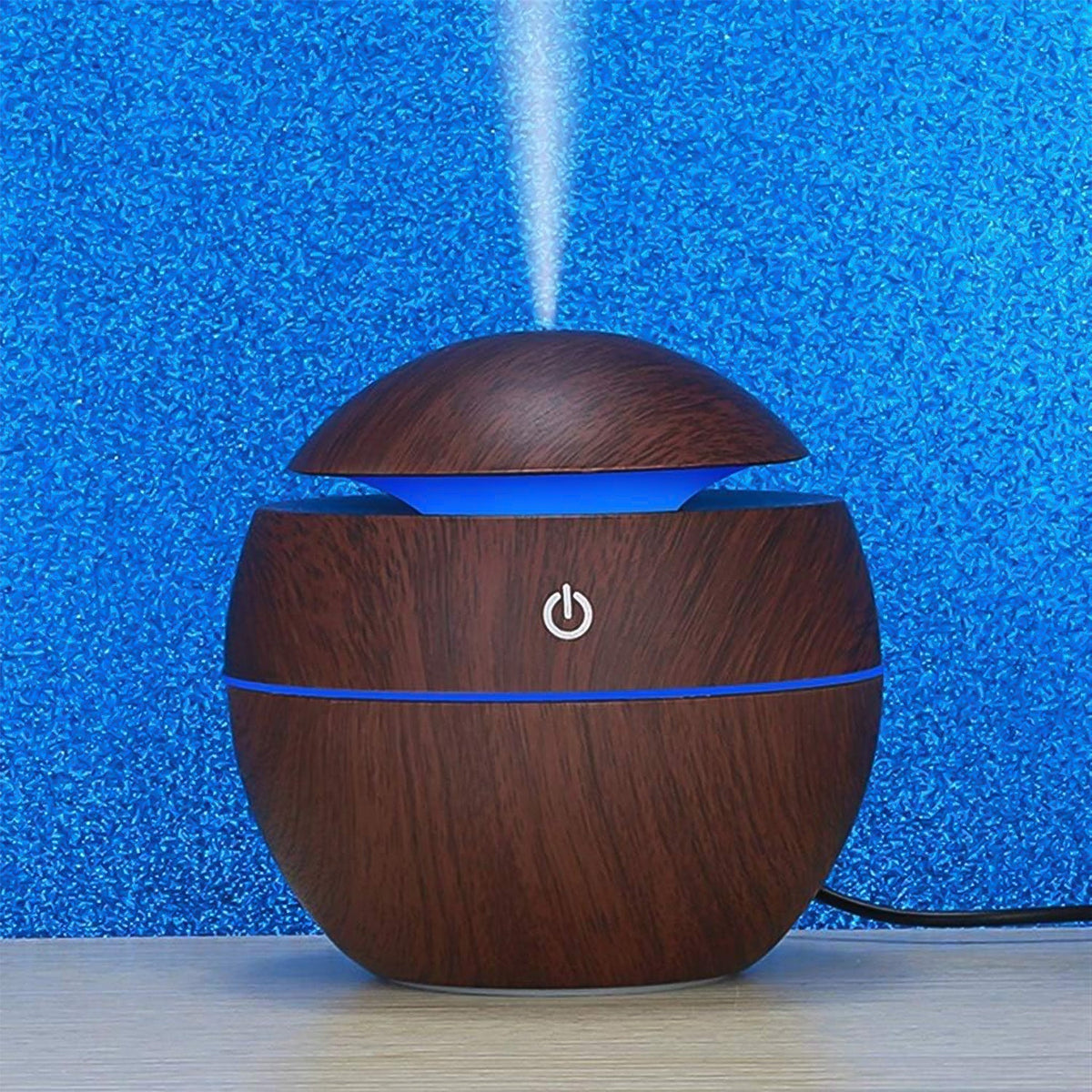 Compact USB desktop humidifier with multi-color LED lights on a clean surface. Main image