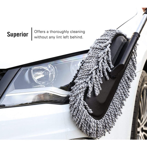Person holding the comfortable grip of the Velvet Wheels Car Dust Brush, ready for detailed cleaning.