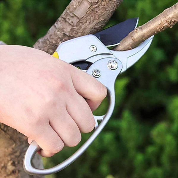 Pruning shears tool resting on garden deck showing sturdy construction