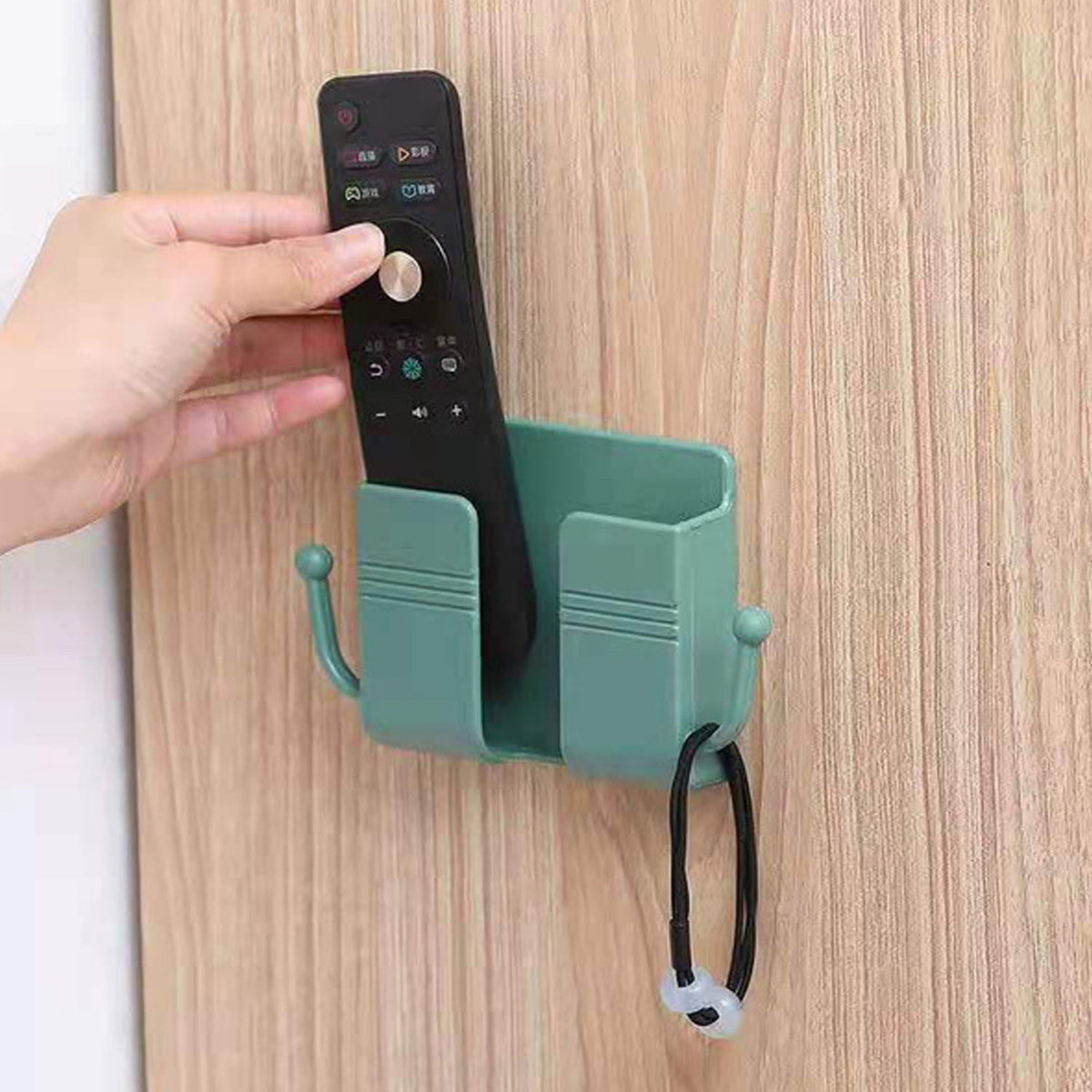 Compact wallmount mobile stand with integrated hook, holding a smartphone and keys. Main image