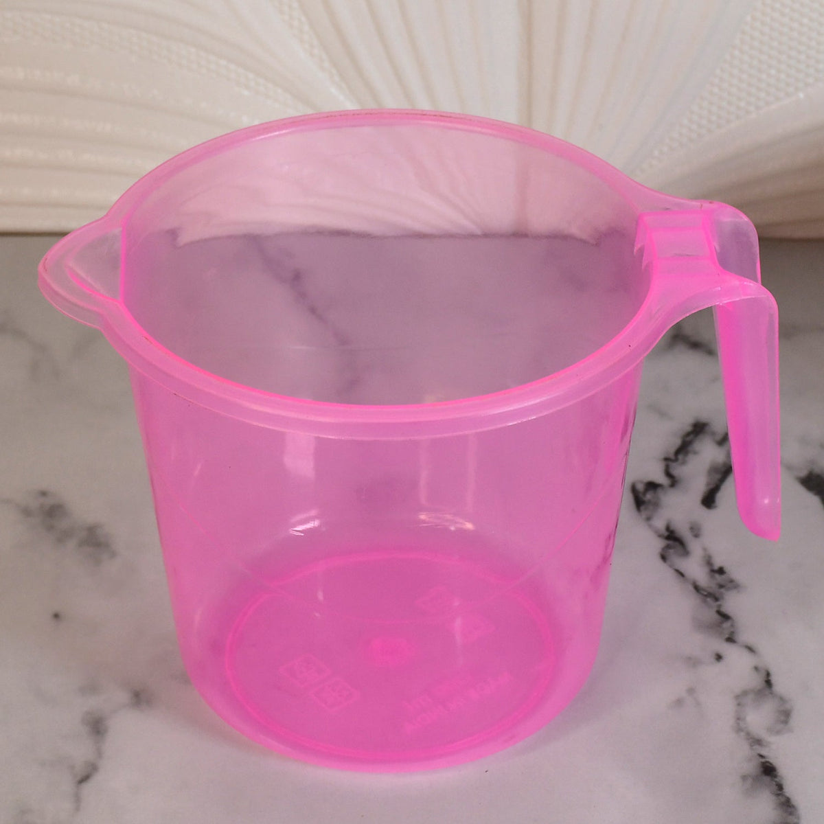 Transparent 1200ml bath water mug from Bathora, ready for use in a clean bathroom. Main image