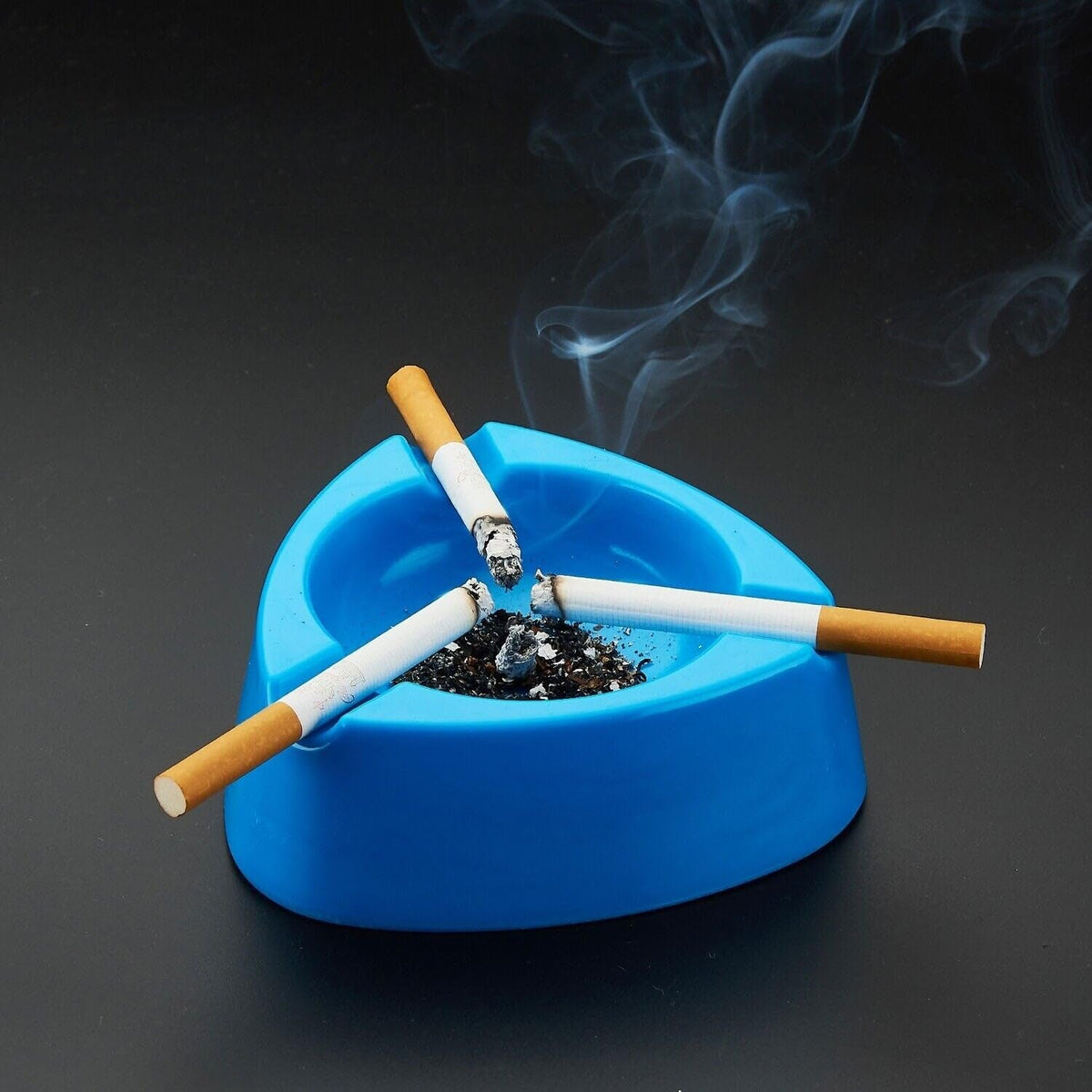 Sky blue plastic ashtray with wide bowl and triple cigarette holder slots Main image