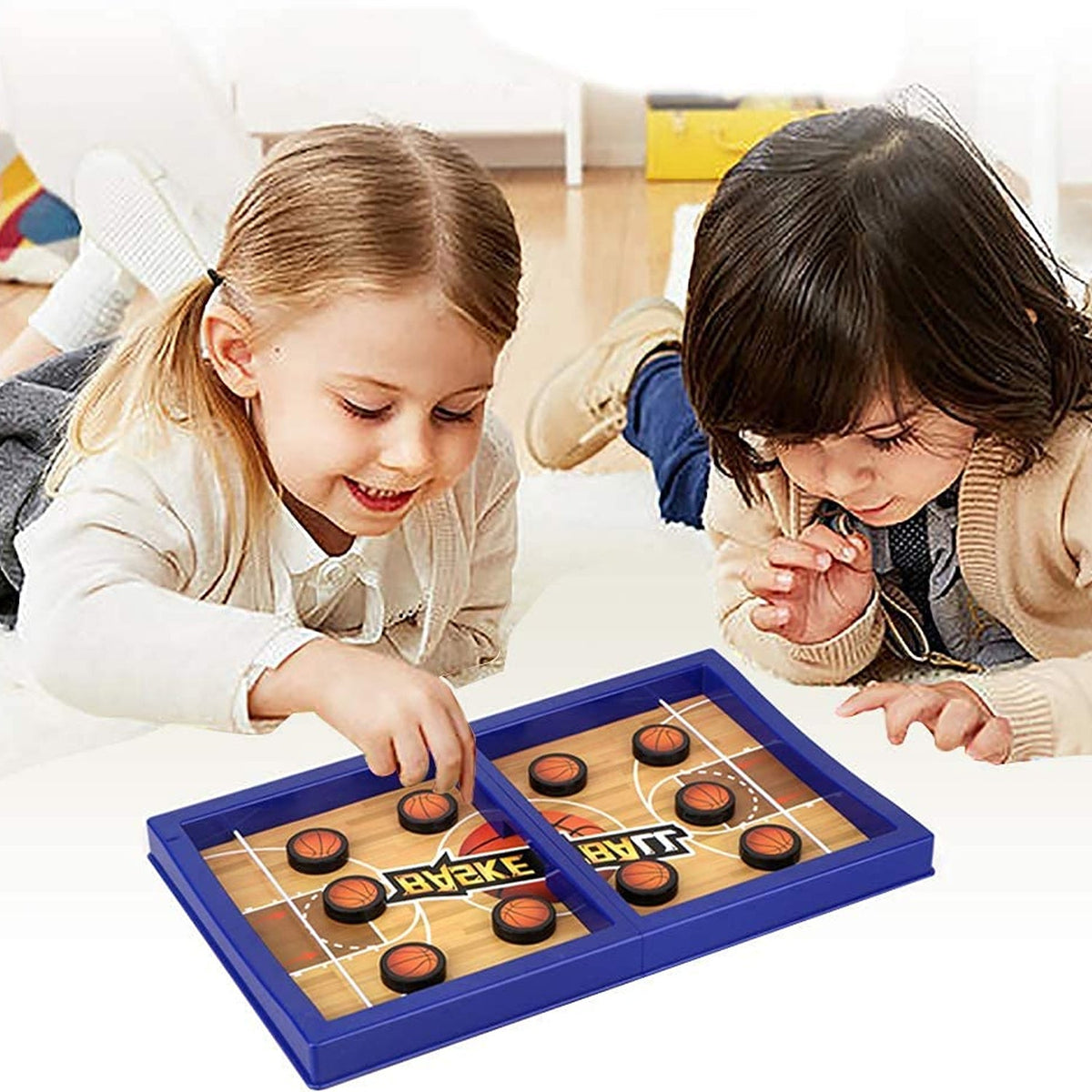 Kids enjoying a fast-paced desktop basketball game on a wooden table. Main image