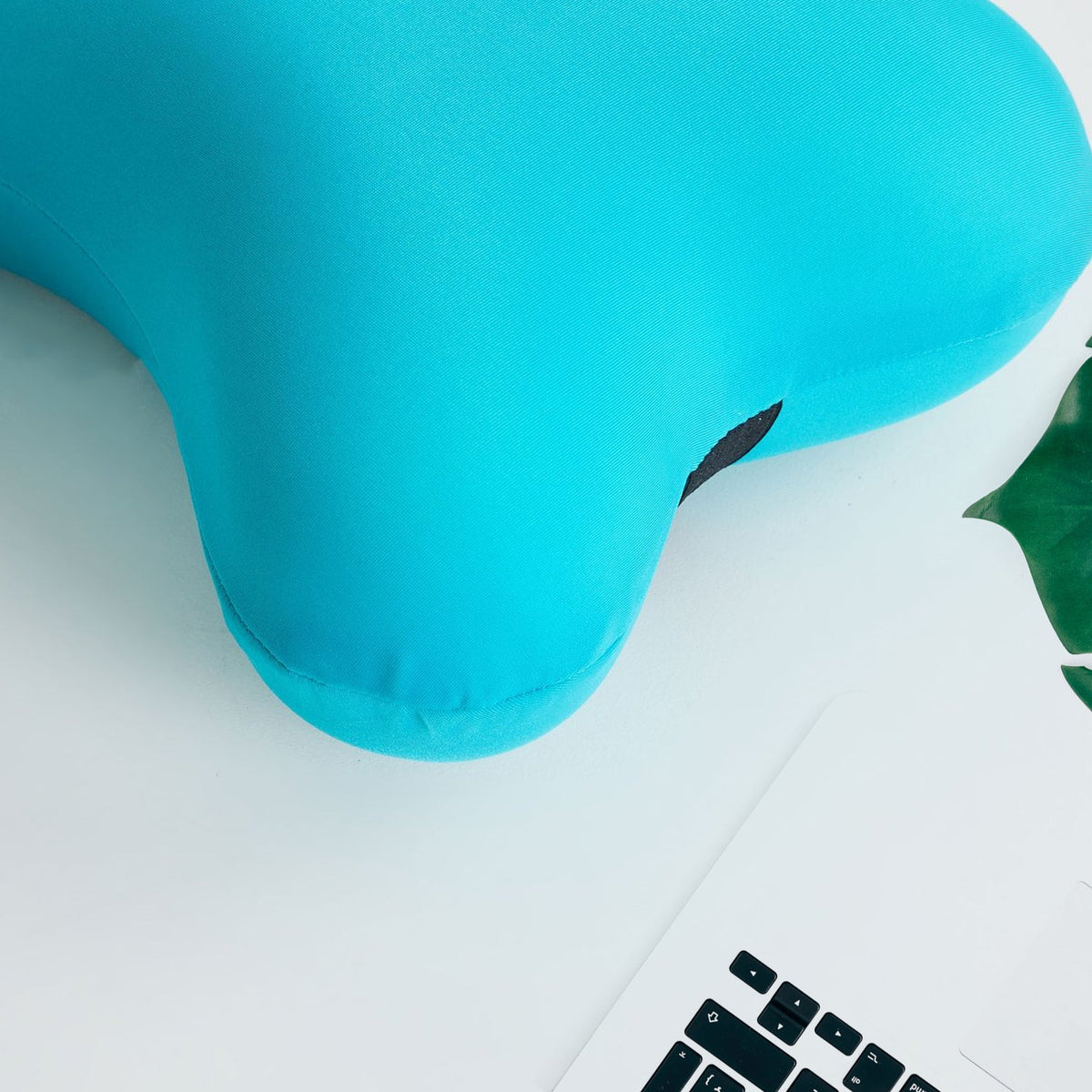 Detailed view of the soft microbead neck pillow's texture. Main image