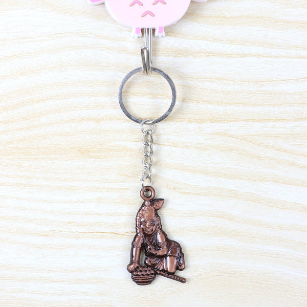 Metal Bal Krishna keychain attached to a set of keys