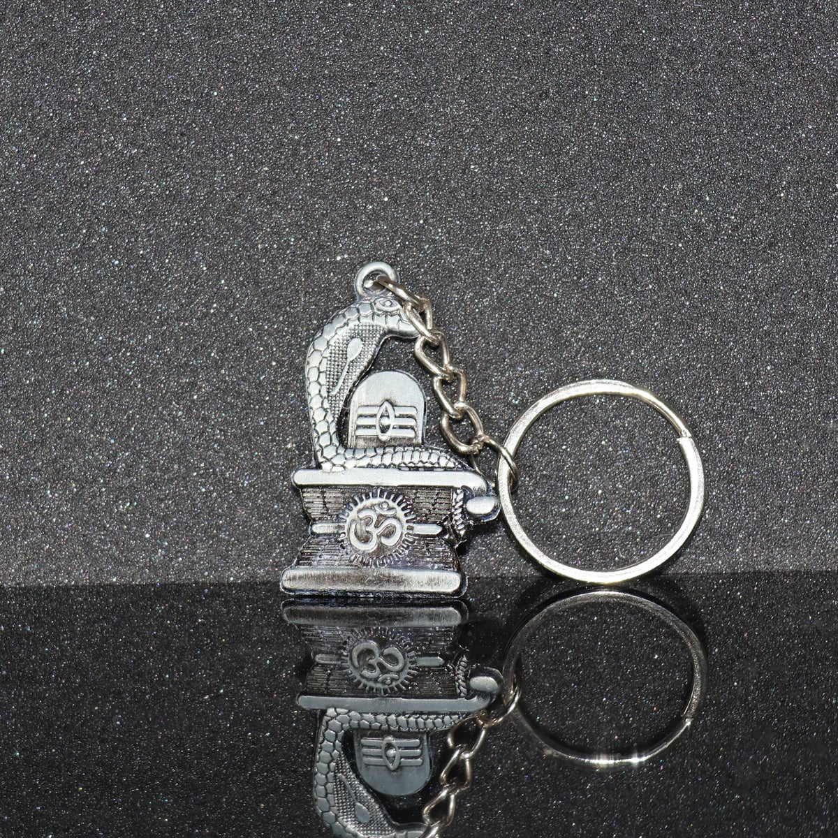 Elegant Shivling keychain with snake design in silver metal Main image