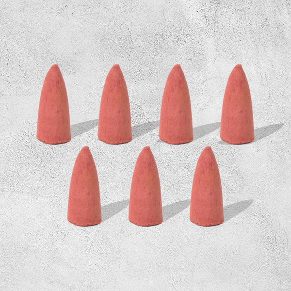 A pack of specialized backflow incense cones, essential for creating the smoke waterfall effect.