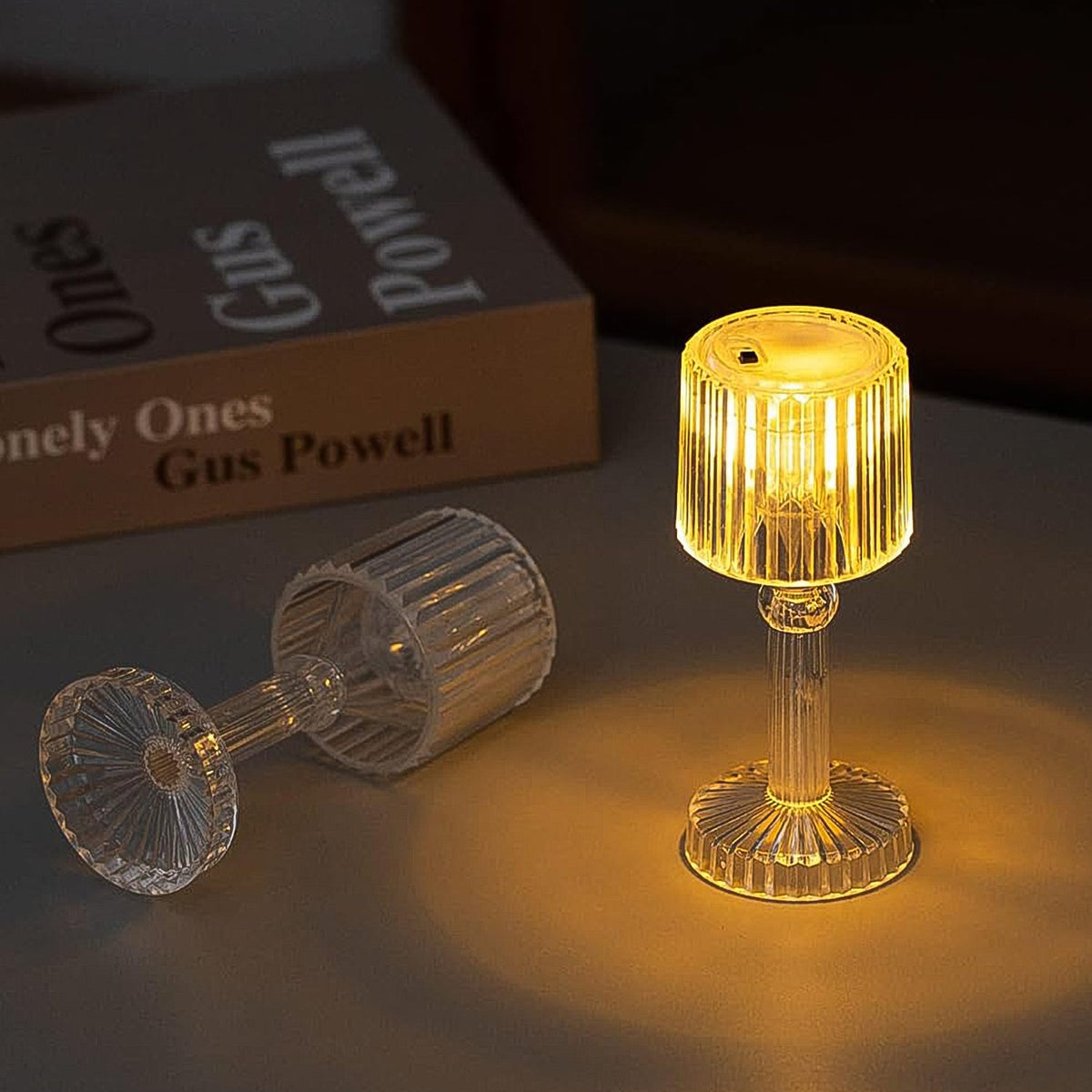 Crystal LED desk lamp illuminating a modern living space. Main image
