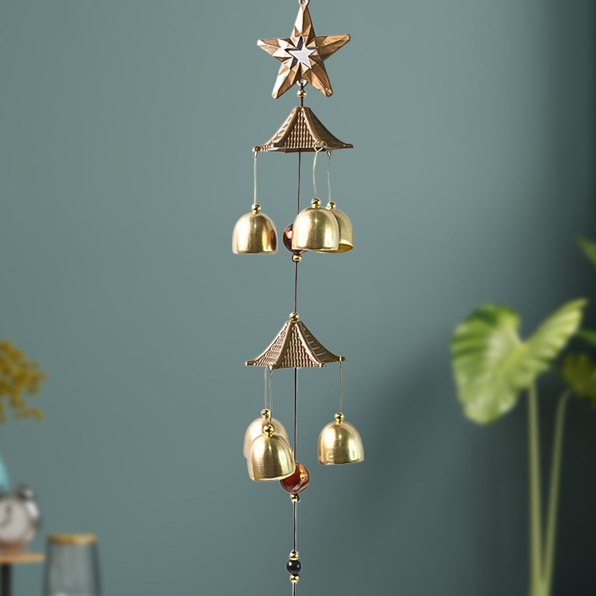Dragonfly wind chime hanging outdoors with vibrant colors and soothing tones Main image
