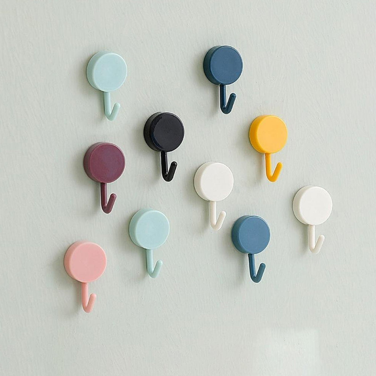 Pack of 10 transparent self-adhesive wall hooks on a white surface. Main image