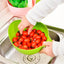 A Quickslice rice washing bowl with a thick drain basket and handle, perfect for kitchen use.
