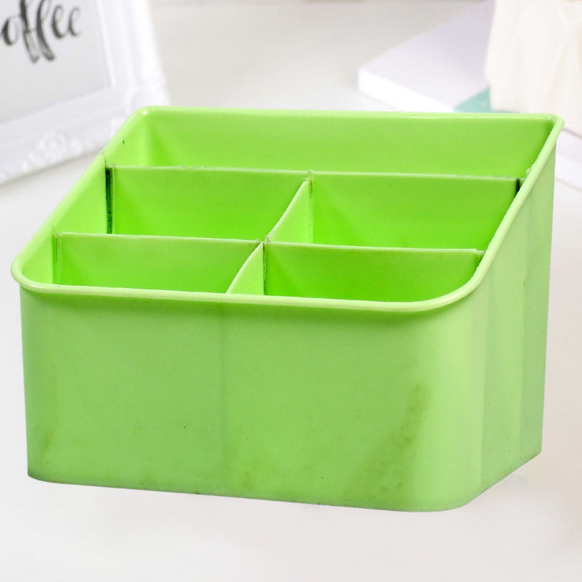 Clear plastic storage box holding cosmetics on a bathroom counter. Main image