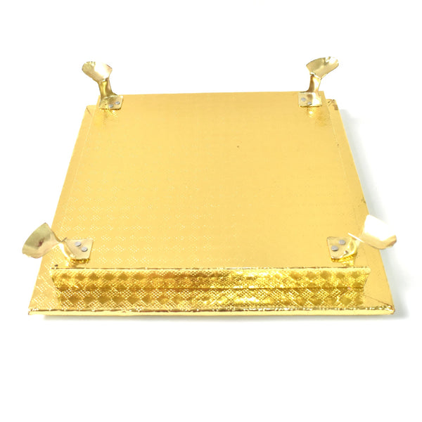 Golden Square Pooja Chowki displayed in a home temple setting.