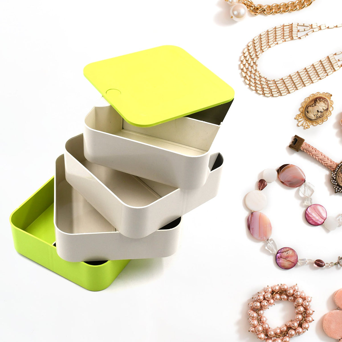 Elegant 4-layer Rotating Jewelry Box in white, ideal for storing earrings and rings. Main image