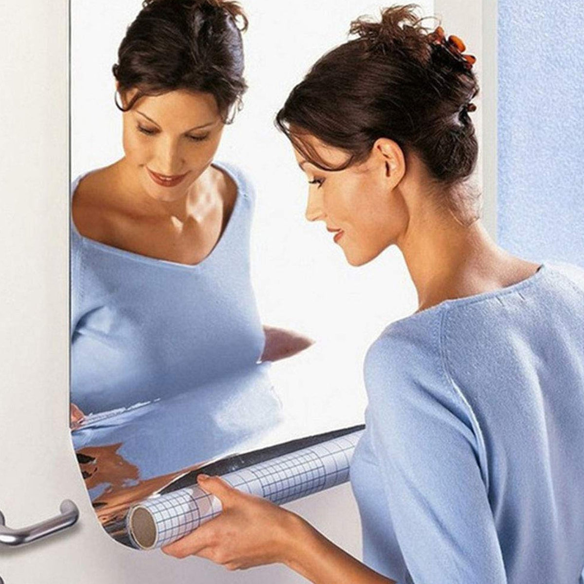 Styleva 3D mirror wall stickers creating a modern look in a living room. Main image