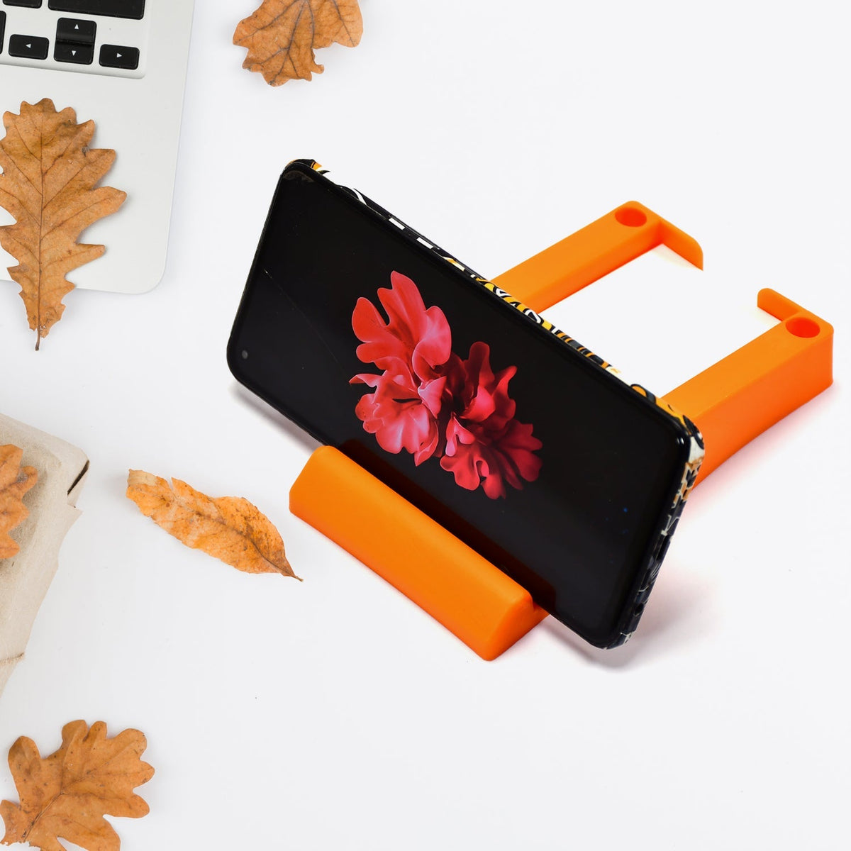Plastic business card and mobile holder stand on desk Main image