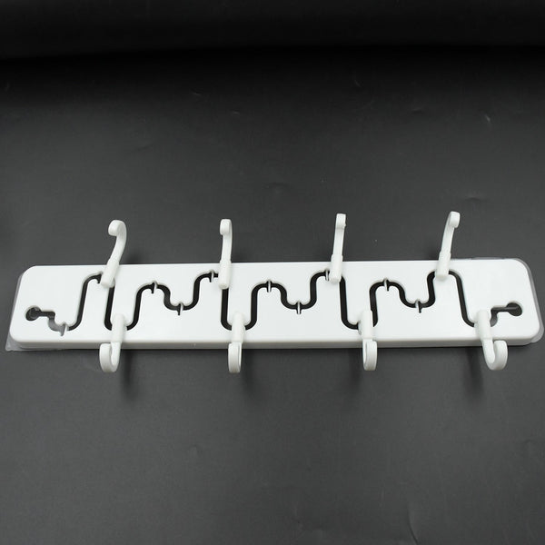 Modern adjustable wall hook installed in a bathroom, holding a towel.