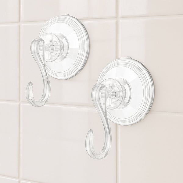 Four plastic suction cup hooks arranged for hanging items