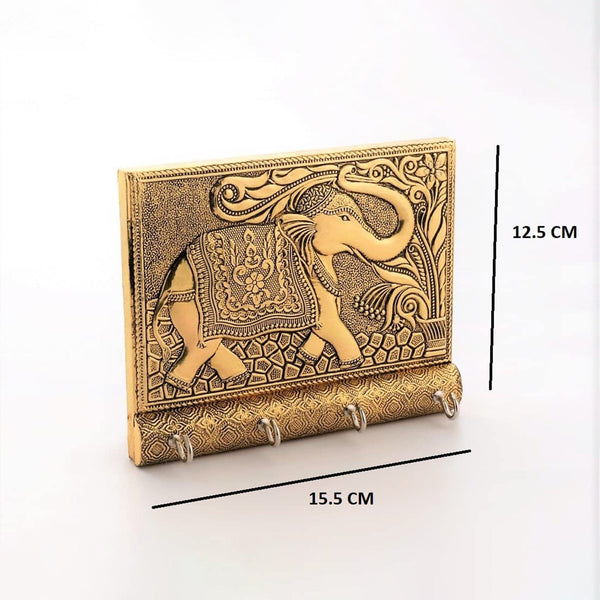 Angled view highlighting the intricate details of the wall-mounted wooden elephant key holder.
