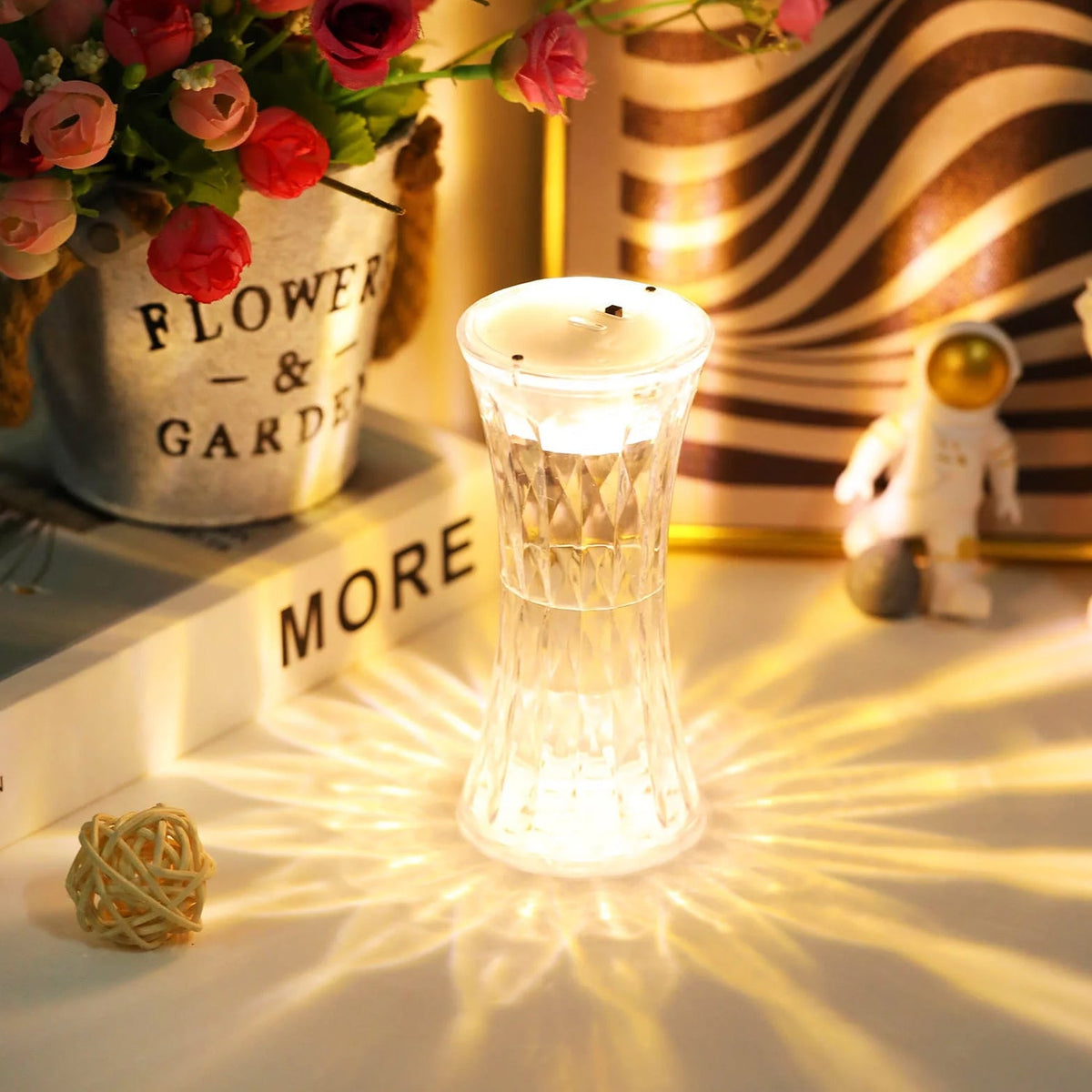 Crystal Night Light illuminating a bedside table with a soft, warm glow. Main image