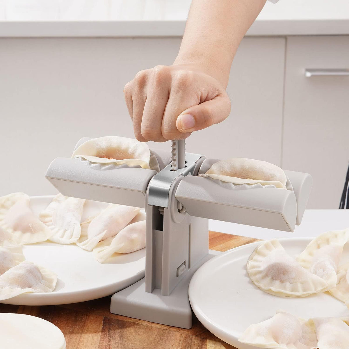 Double head dumpling maker mold in use, creating two perfectly shaped dumplings. Main image