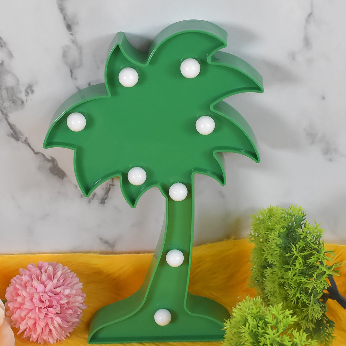 A Tidy Table Coconut Tree LED Lamp emitting a warm glow on a dark background. Main image