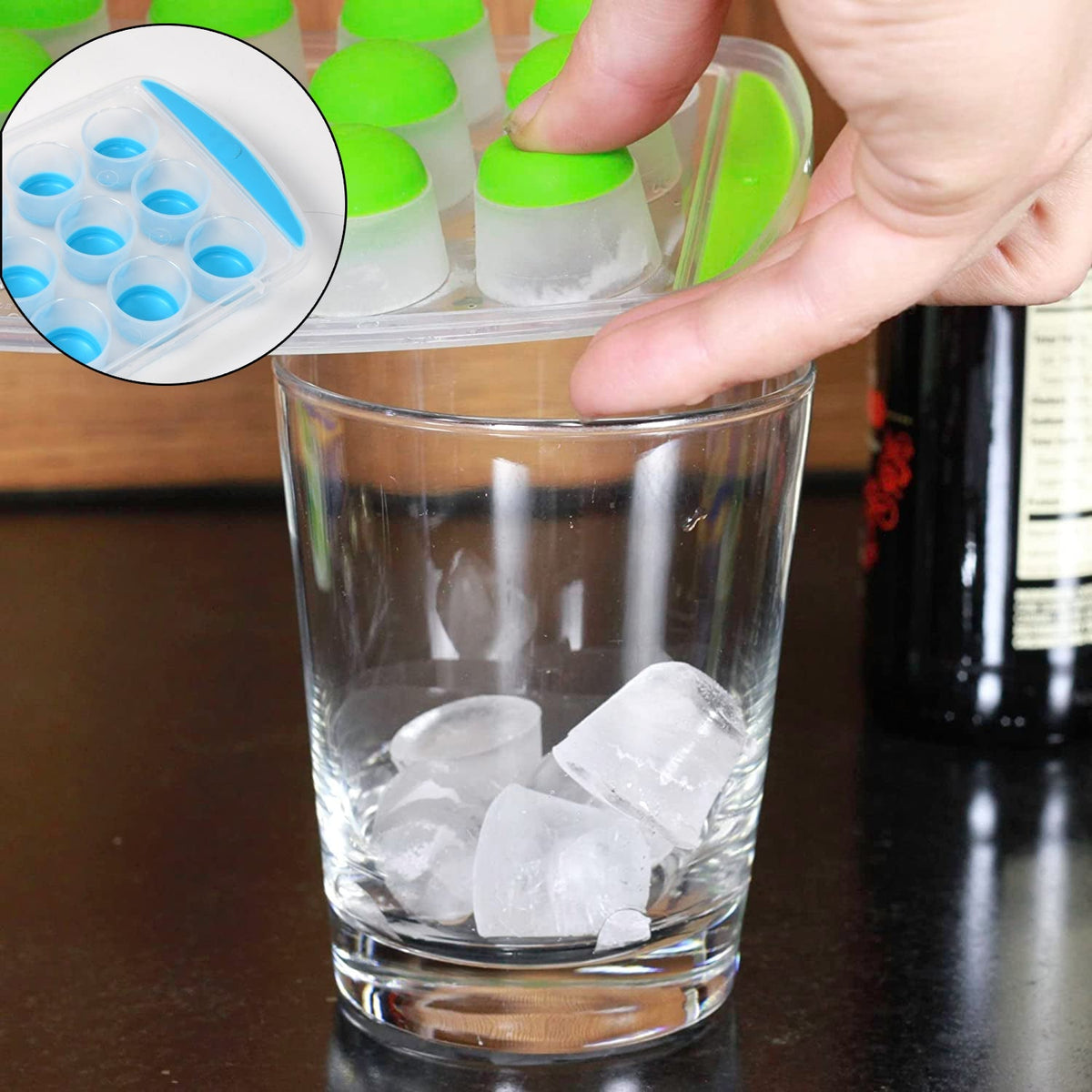 A vibrant blue round silicone ice cube tray filled with perfectly formed mini ice cubes. Main image