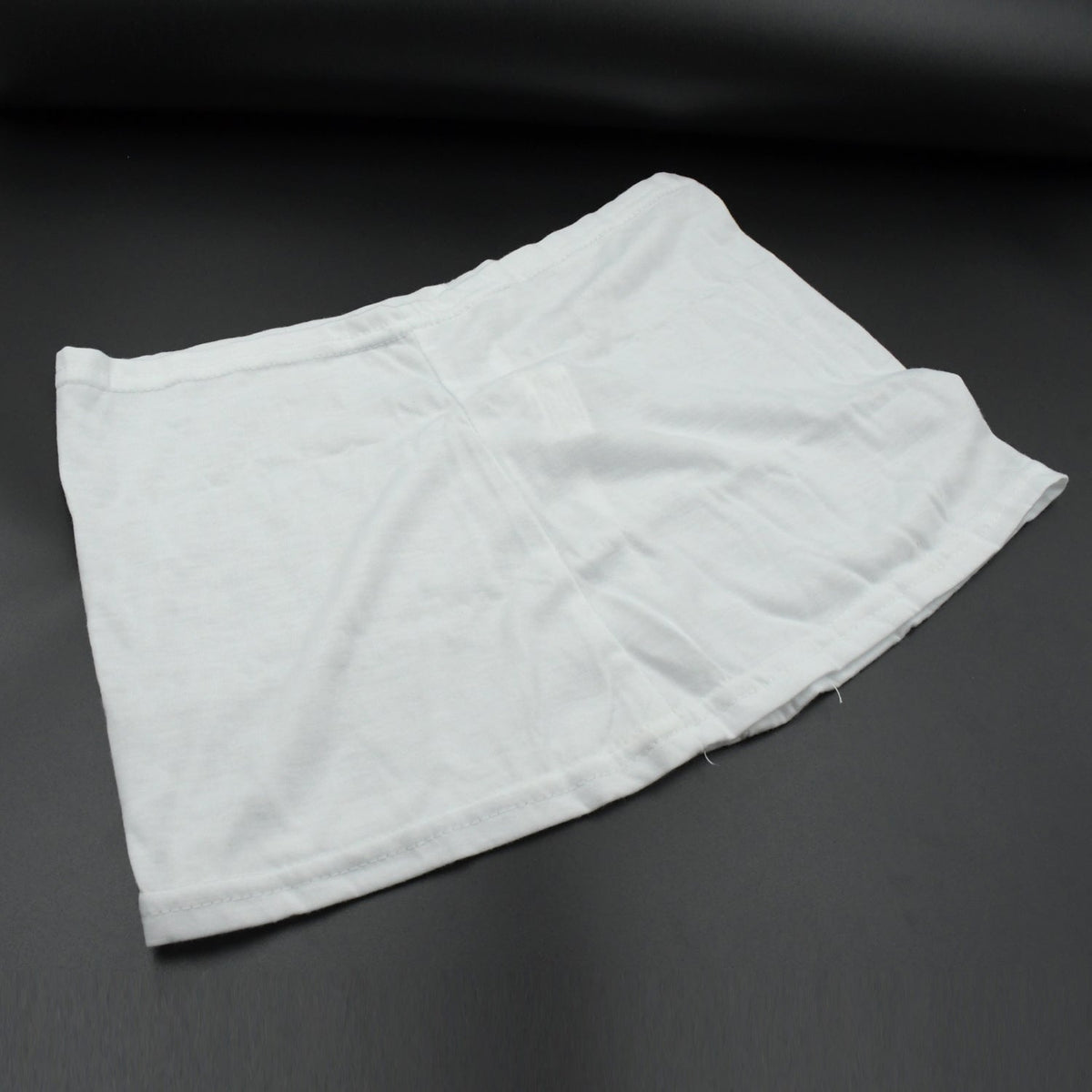 Women's high-waisted athletic skort front view in white. Main image