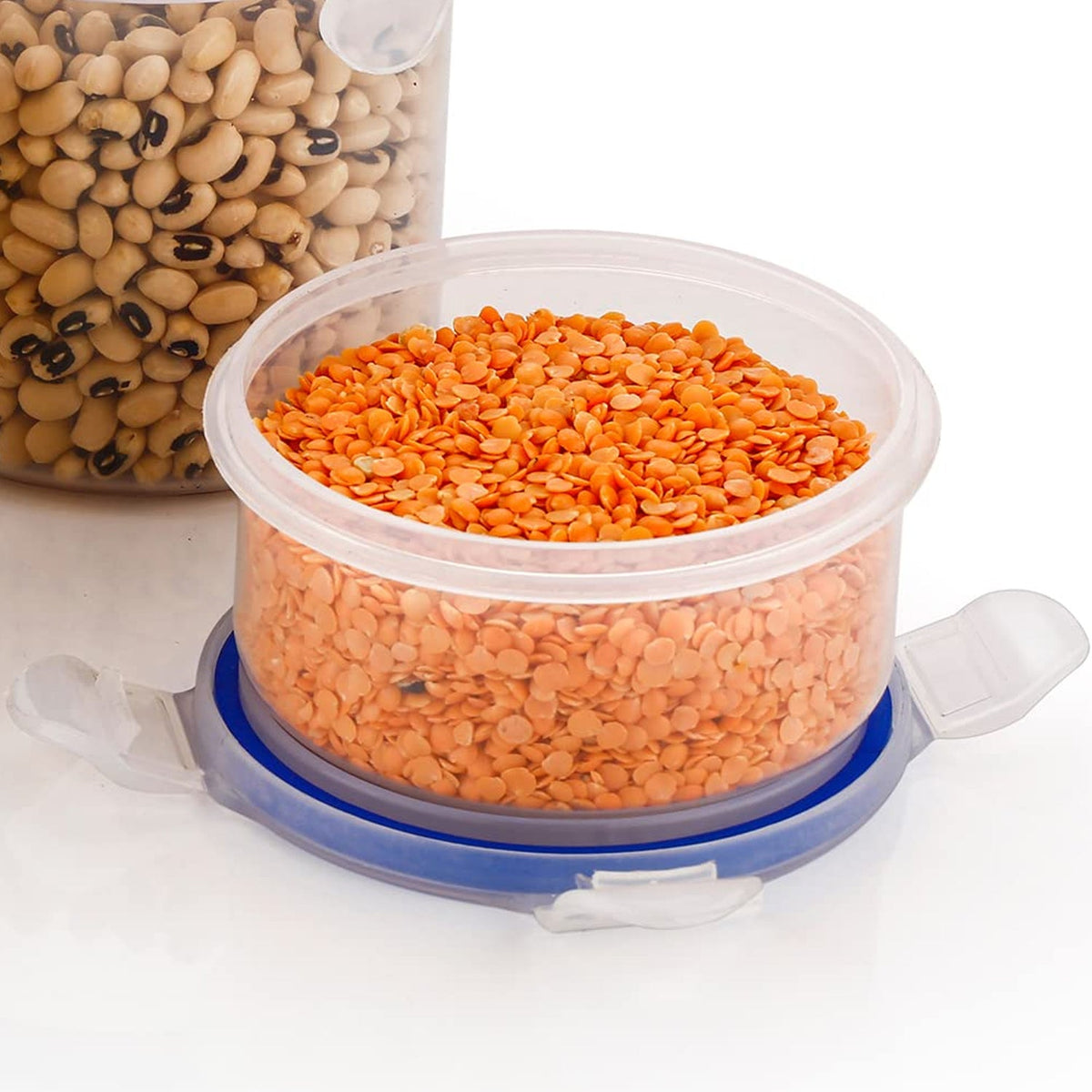 Set of three round airtight food storage containers with transparent bodies and blue leakproof lids. Main image