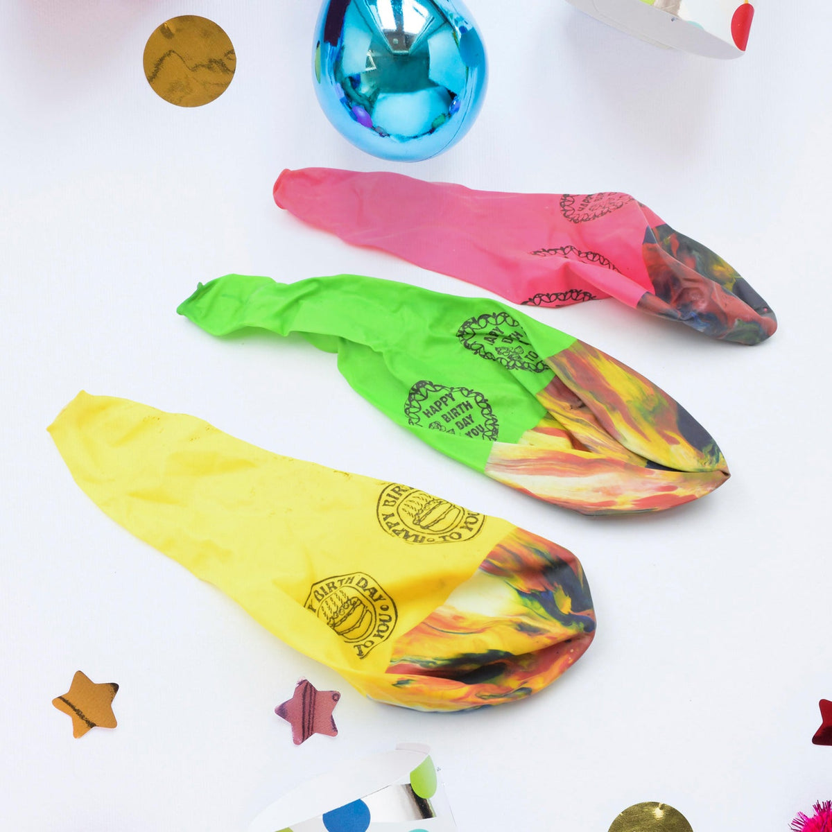 Multicolor rainbow party balloons floating against a light background. Main image