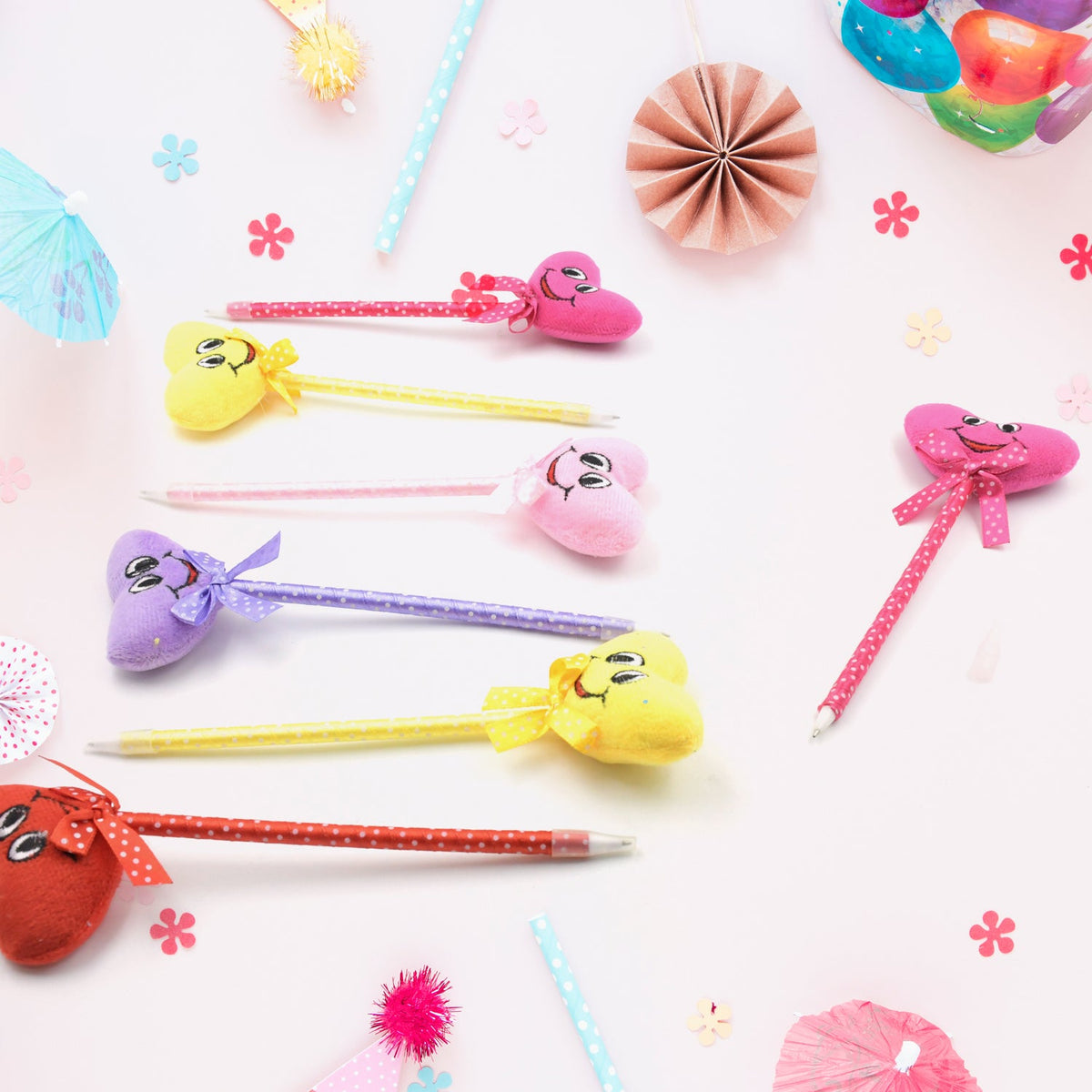 Collection of 12 fun cartoon and heart design ballpoint pens with rattles. Main image