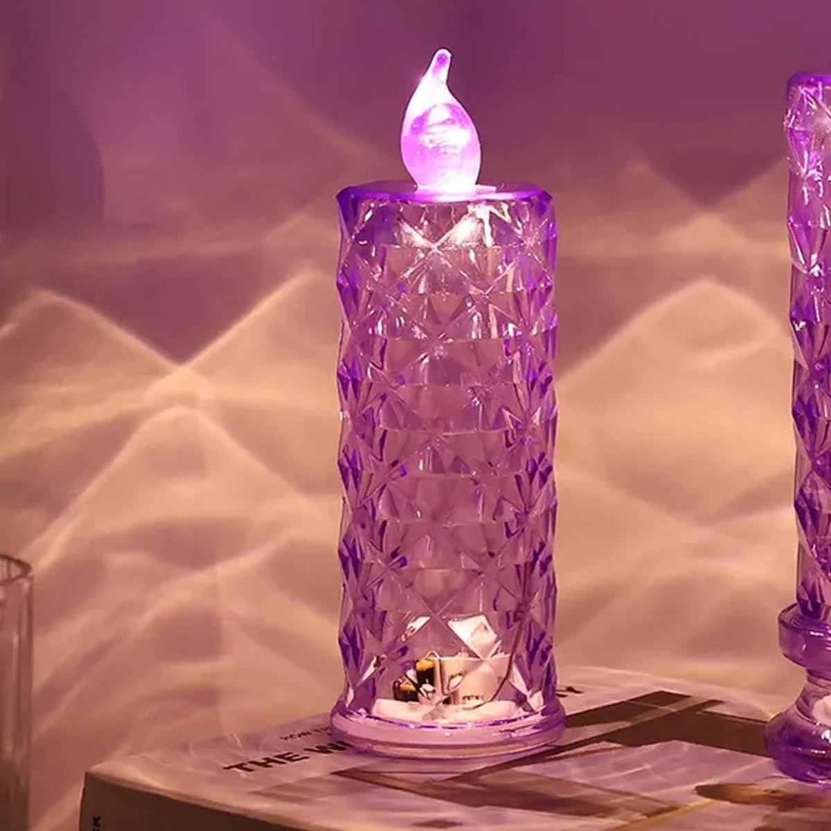 Multicolor crystal candlelight LED decorative candle glowing softly in home setting Main image