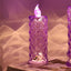 Multicolor crystal candlelight LED decorative candle glowing softly in home setting