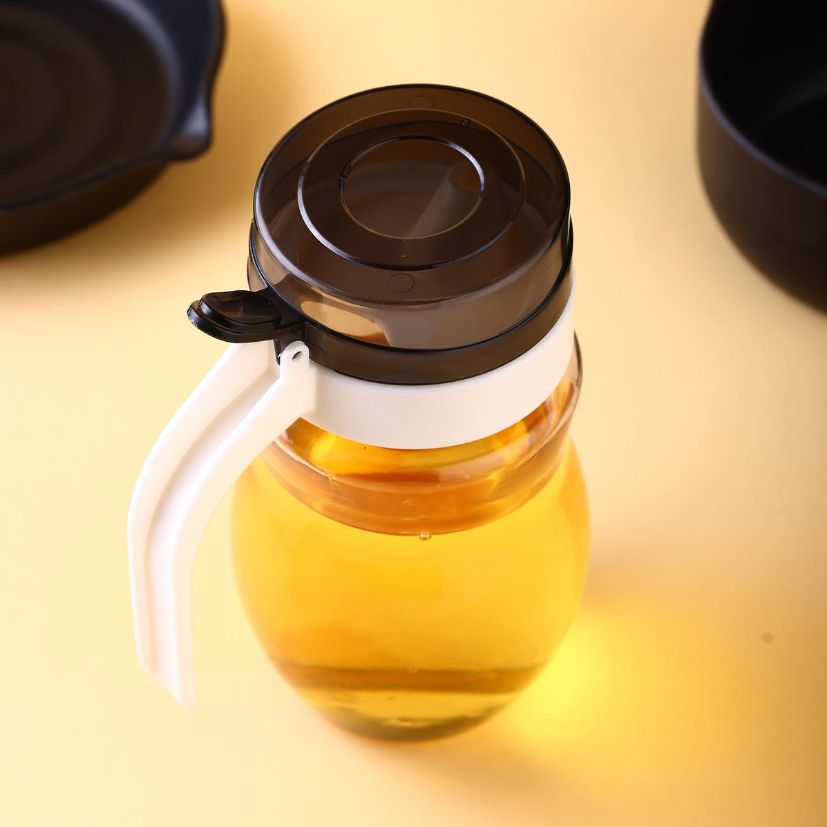 650ml plastic oil dispenser with sleek design for kitchen use. Main image