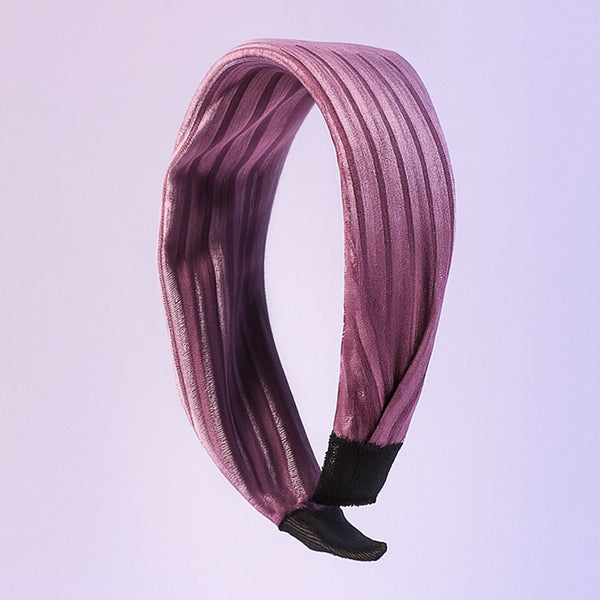 Dark ribbed knot hairband on white background showcasing textured fabric