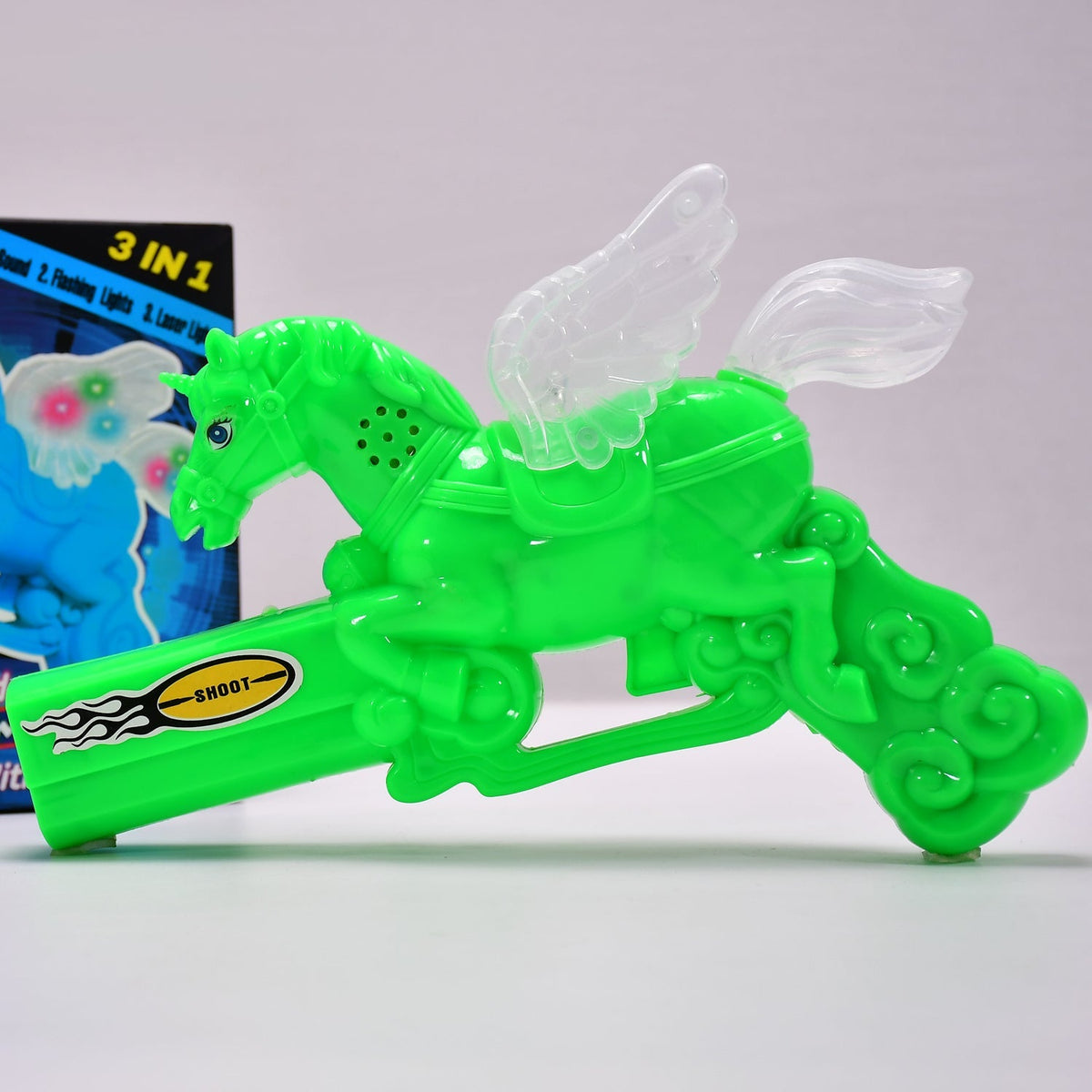 Child holding a colorful musical laser light toy gun with bright effects. Main image