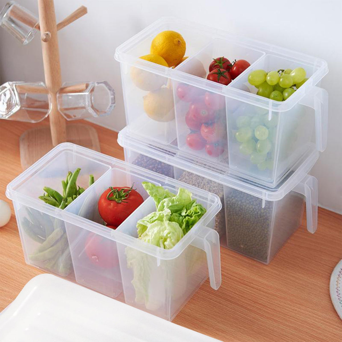 Transparent refrigerator organizer box with three compartments. Main image