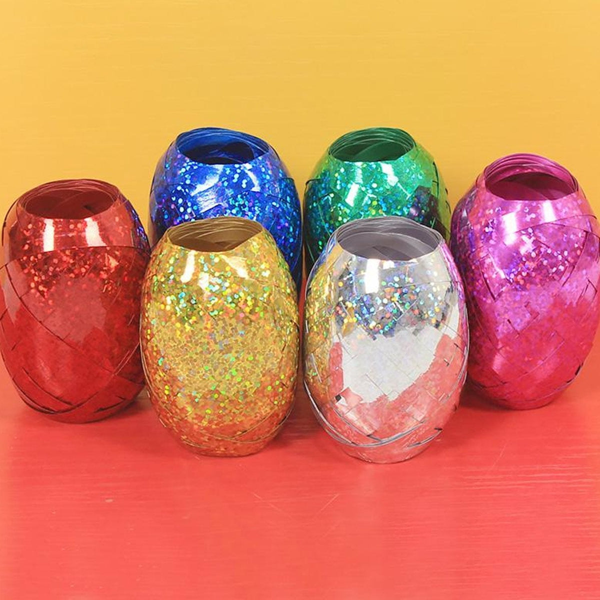 Multicolor curling ribbon rolls displayed for festive party decorations. Main image