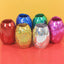 Multicolor curling ribbon rolls displayed for festive party decorations.
