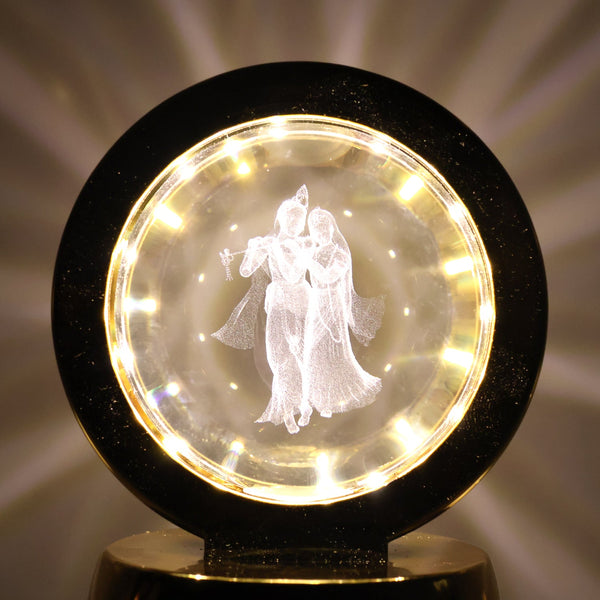 Golden base Radhe Krishna decorative lamp emitting soft ambient LED light