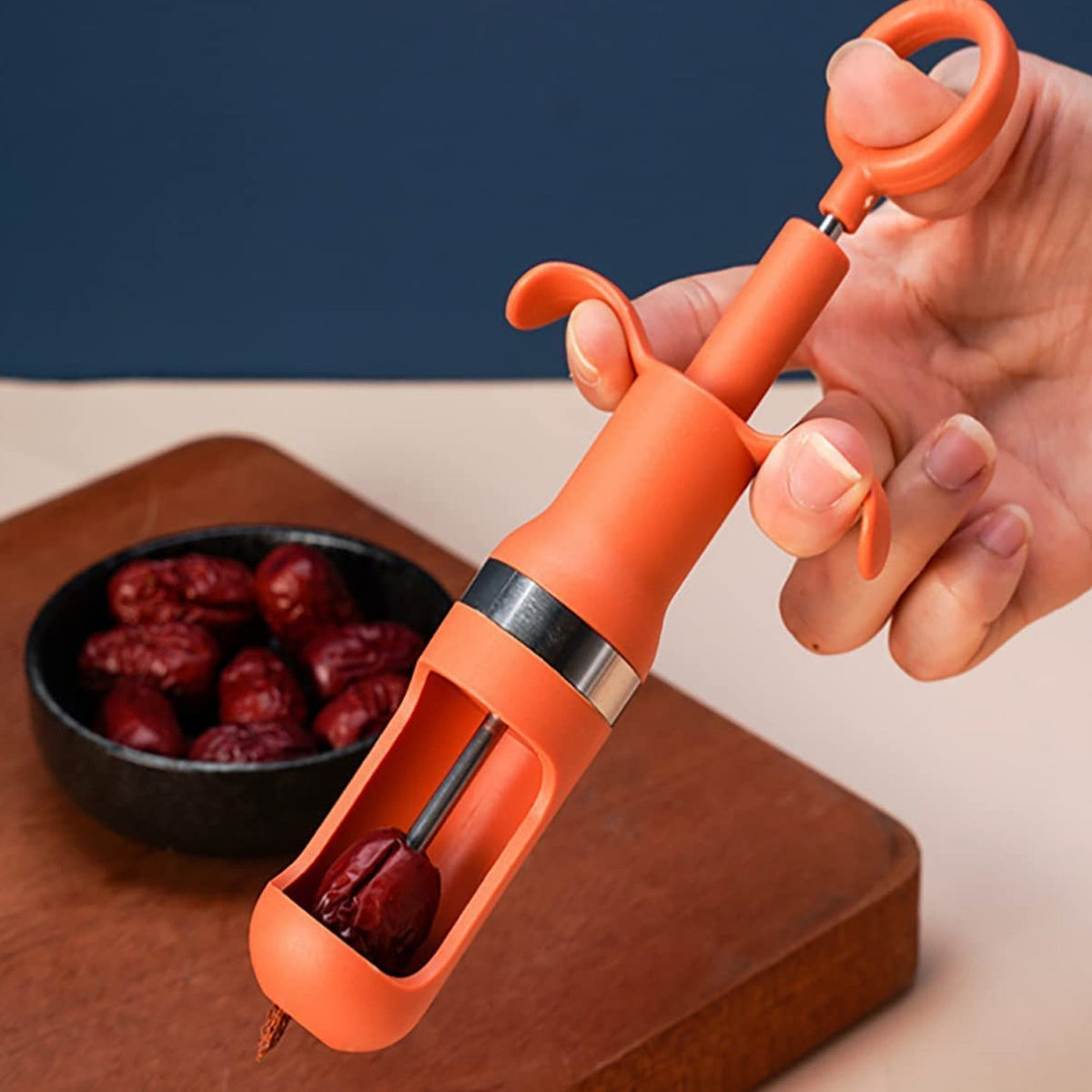 Ergonomic cherry pitter tool for effortless one-hand operation. Main image