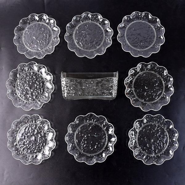 9-piece plastic bowl set with serving tray displaying transparent bowls and plates