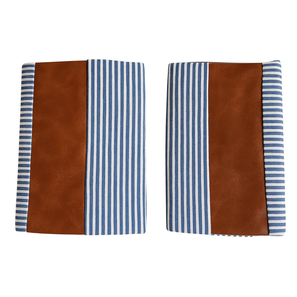 Pair of leather and cotton pillow covers on a modern sofa Main image
