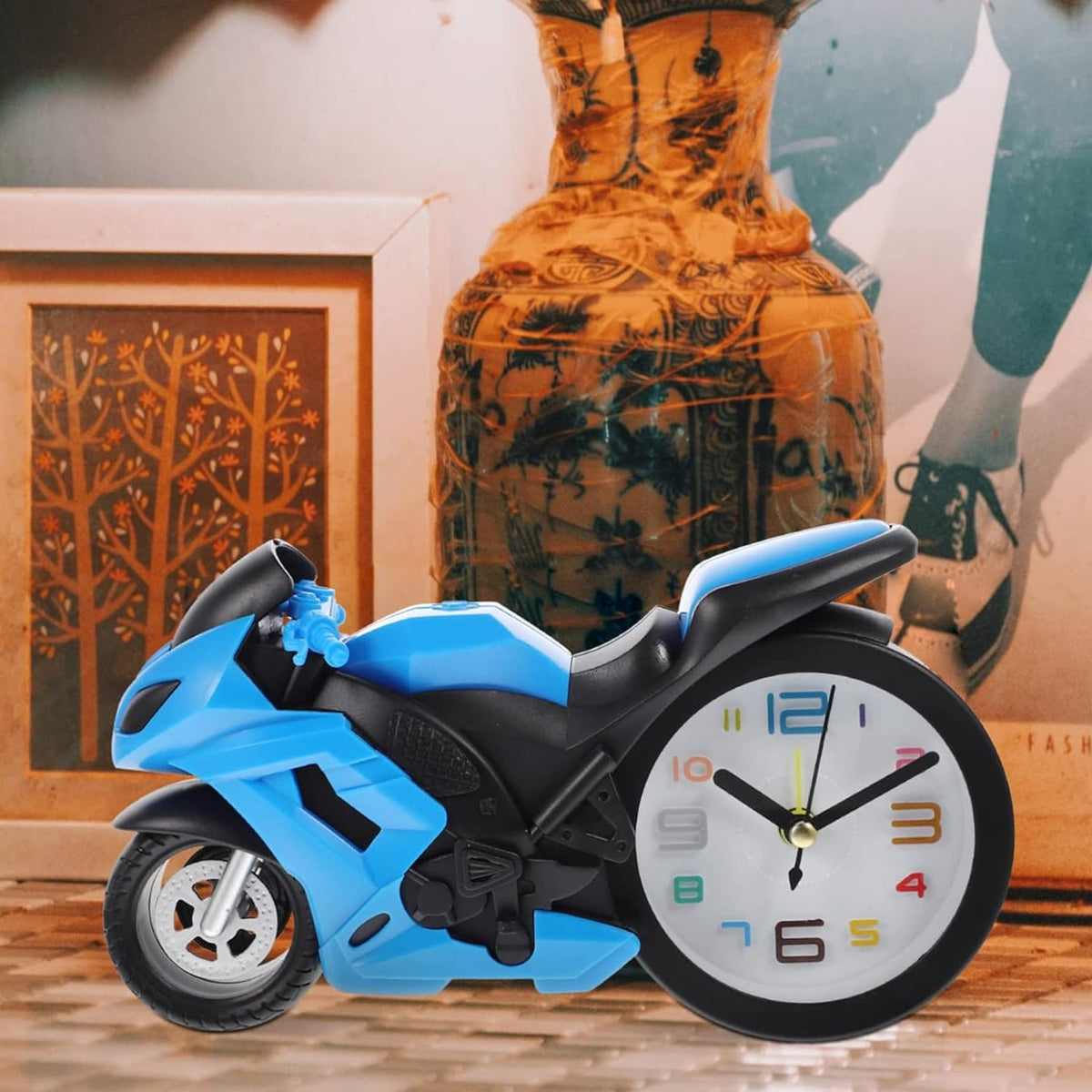 Retro Motorcycle Alarm Clock with a shiny silver finish, viewed from a slight angle on a white surface. Main image