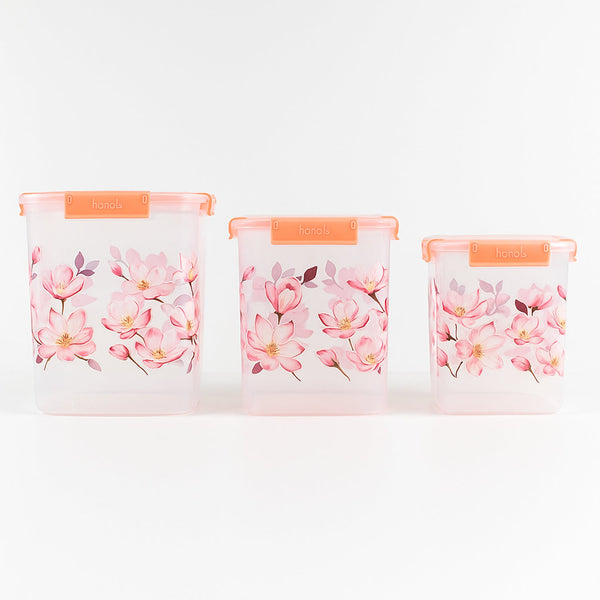 Stackable floral food storage container set with transparent bodies.