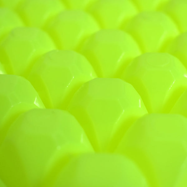 A stream of water filling the easy release ice tray cavities.