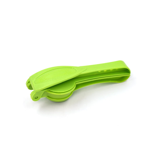 The compact plastic lemon squeezer and bottle opener placed on a clean kitchen surface.