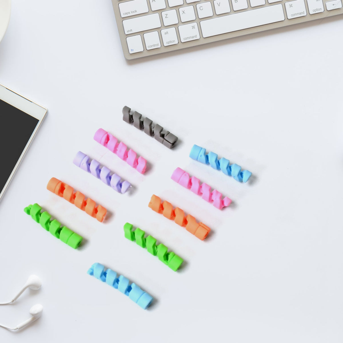 Flexible cable protector wrapped around a white earphone cable. Main image